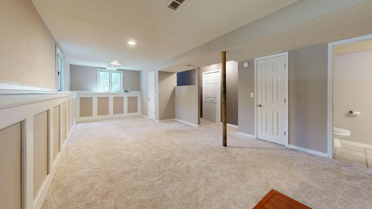 Cozy carpeted basement family room installed in an OKC home