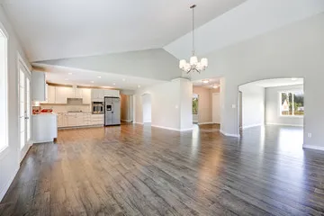 Wood-look laminate flooring in an Oklahoma City open-concept living room