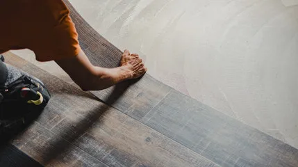 Floors To You OKC installer clicking laminate planks together